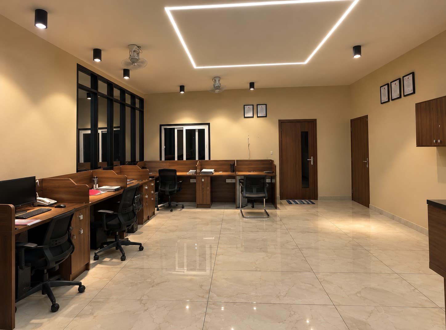 Wide view across the True Froot office, showing timber workstations, warm lighting and an open central floor